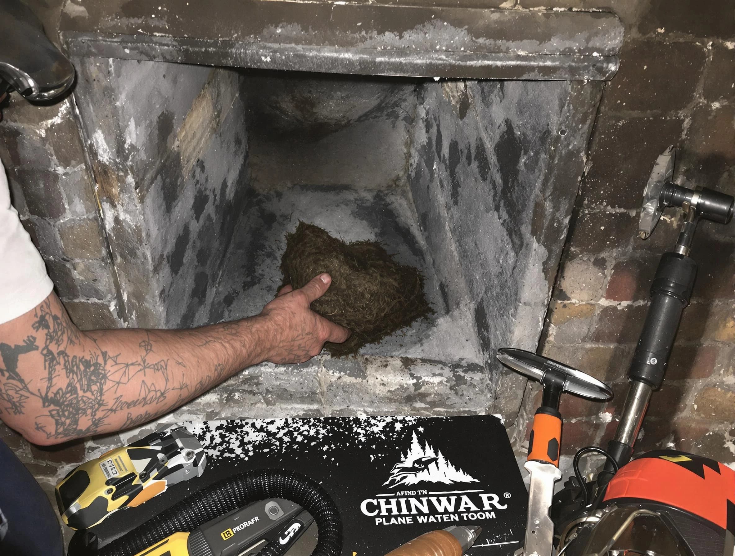 Long Branch Chimney Sweep safely removing debris and screening chimney in Long Branch, NJ